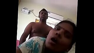 a boy press the girl boobs to remove braw