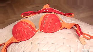 hot milf in red bra blows two guys and gets analed on brown leather couch